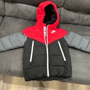 Red and gray Nike puffer jacket